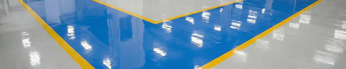 A factory floor professionally covered and marked with epoxy flooring in Cedar Rapids, IA