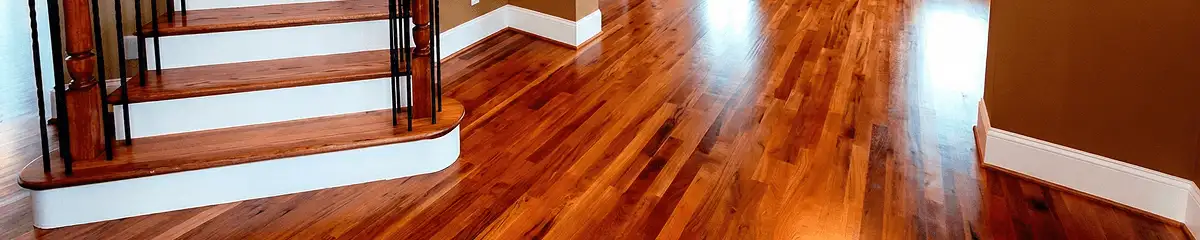 Base floor of a staircase with professionally restored wood flooring in Cedar Rapids IA