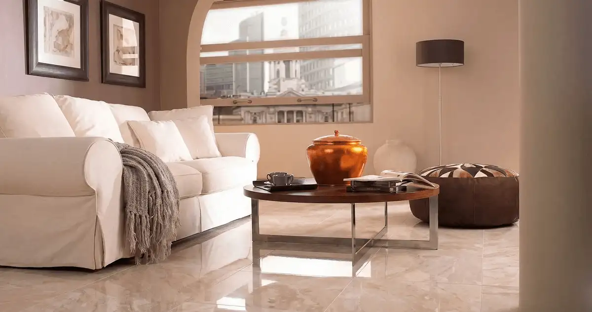 Modern living room with professionally installed marble flooring, a beige sofa, coffee table in Cedar Rapids, IA