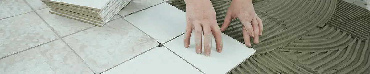 Professional installing white tile floors in Cedar Rapids, IA