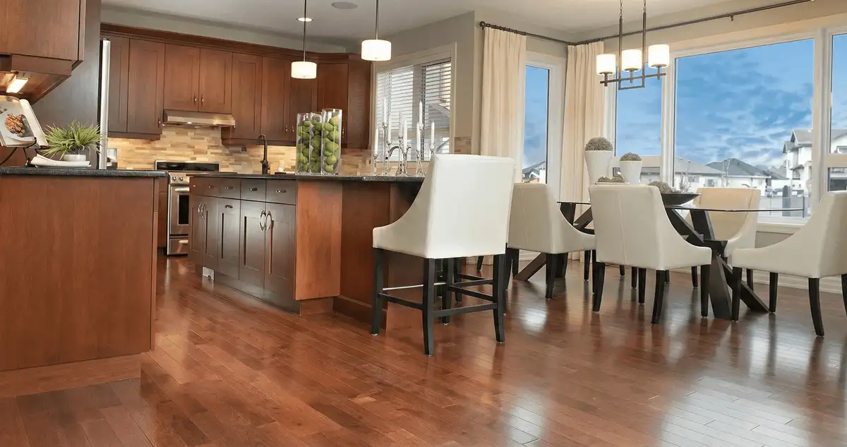 A modern kitchen with professionally installed wood flooring in Cedar Rapids, IA